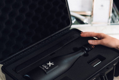COUP hard-sided champagne case shown up close for a premium corporate gift presentation.